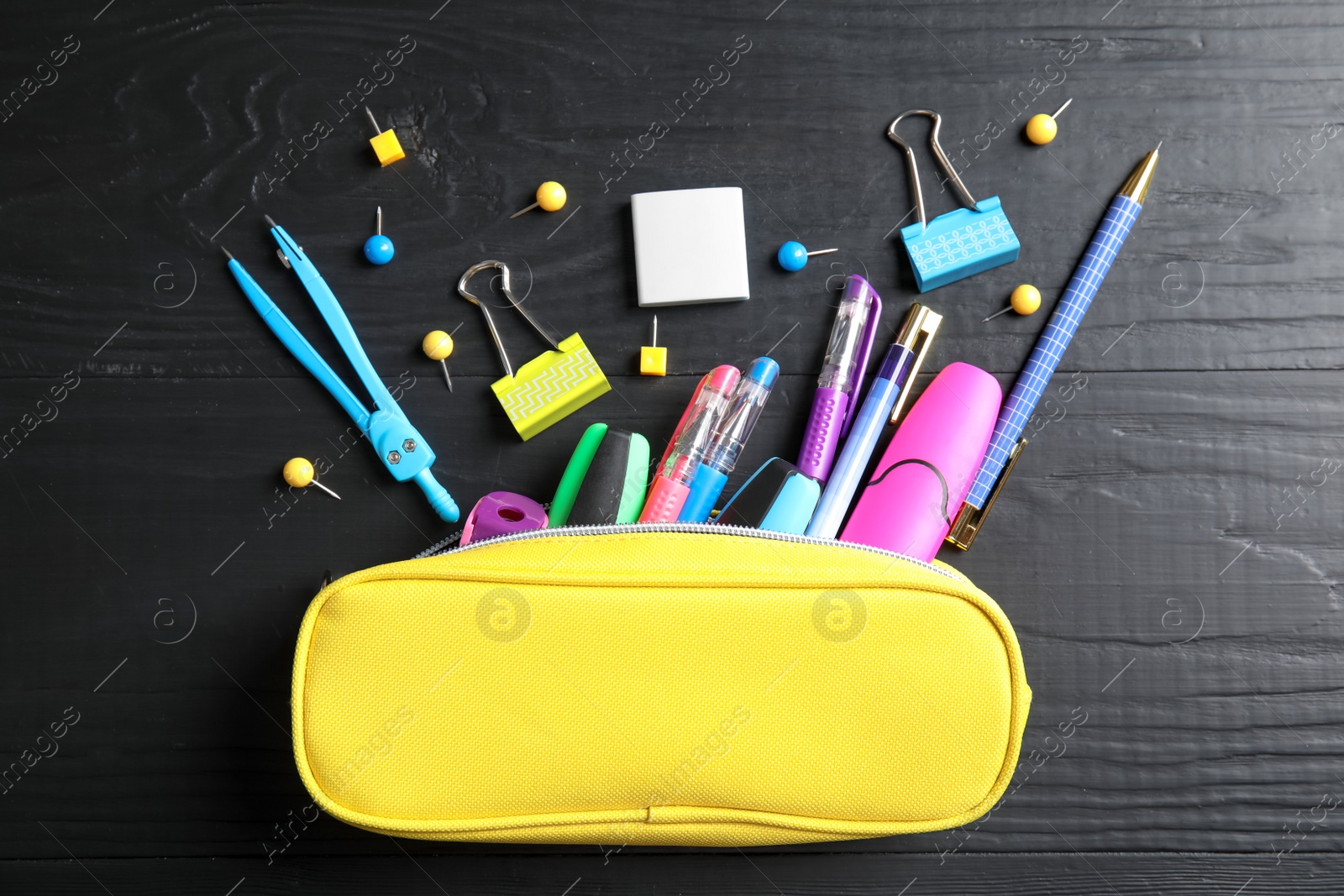 Photo of Different school stationery on wooden background, flat lay