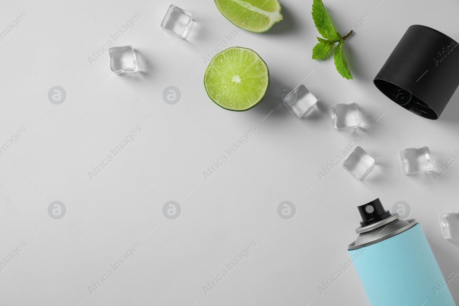 Photo of Composition with spray deodorant on white background, top view