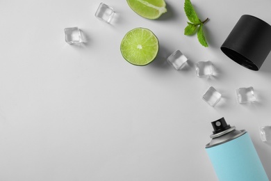 Photo of Composition with spray deodorant on white background, top view