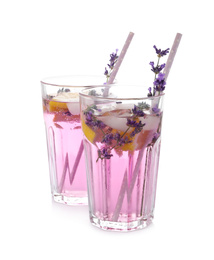 Photo of Fresh delicious lemonade with lavender and straws on white background