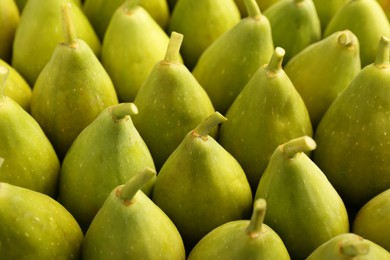 Photo of Many fresh green figs as background, closeup