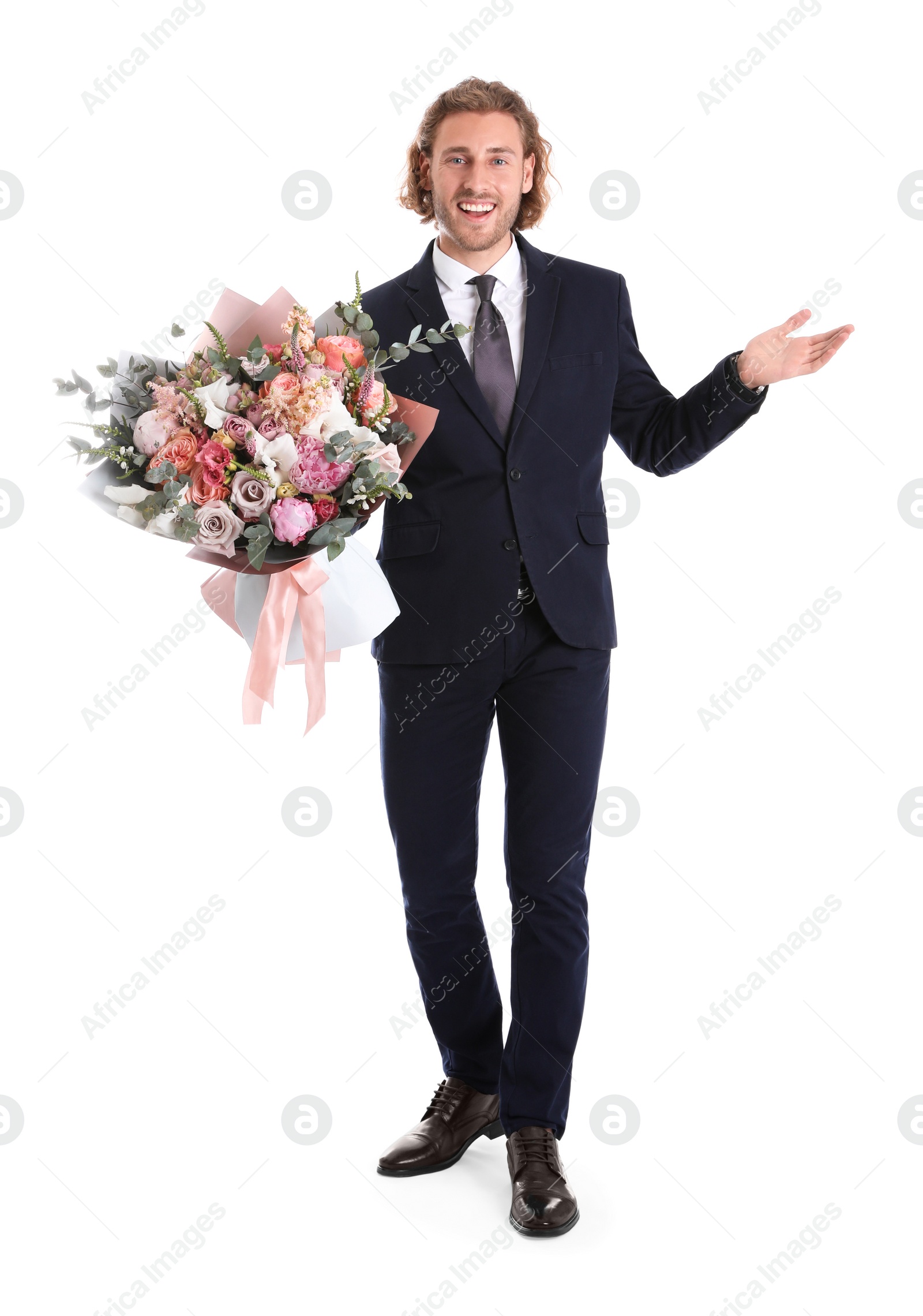 Photo of Young handsome man in stylish suit with beautiful flower bouquet on white background