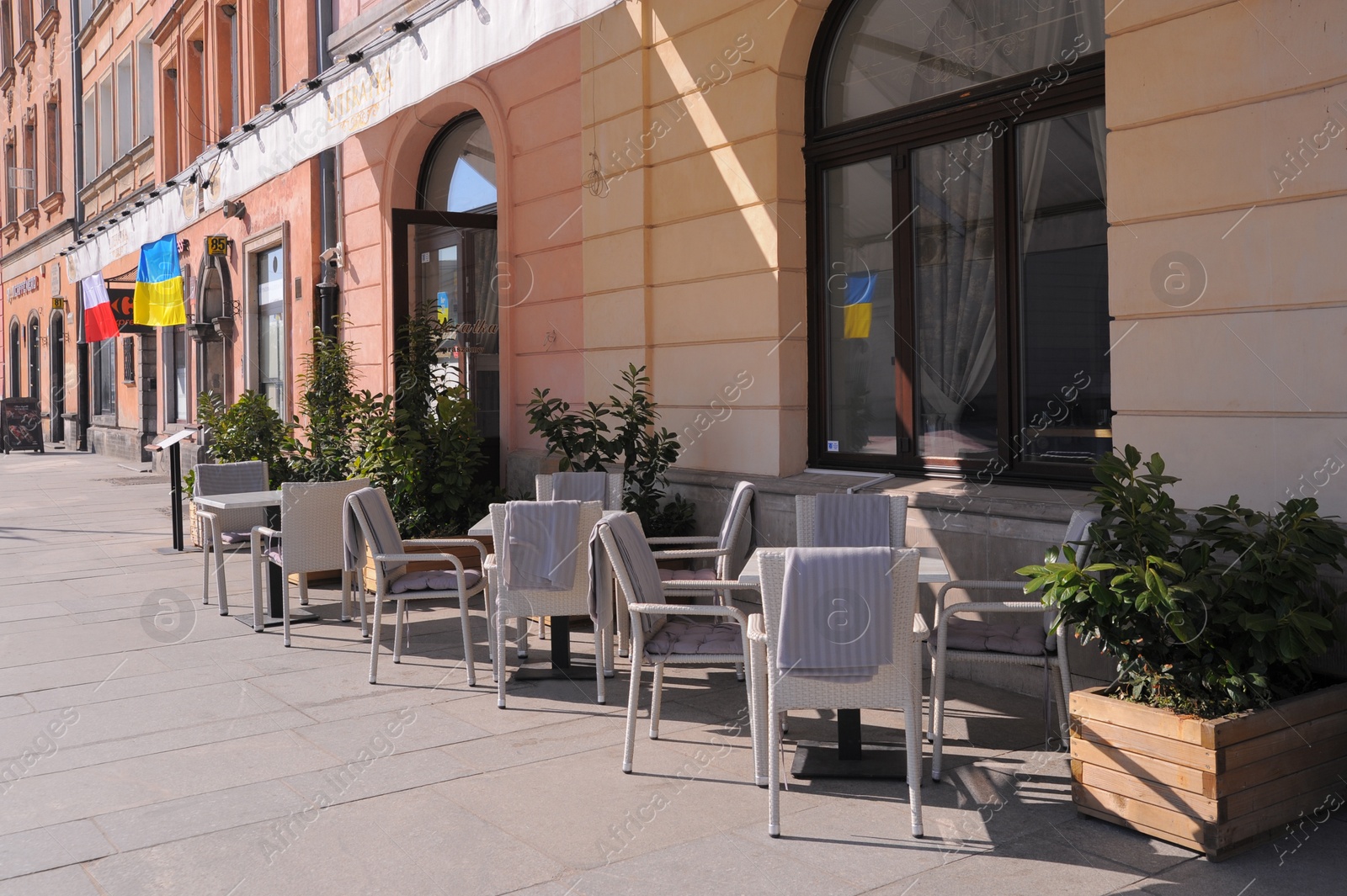 Photo of WARSAW, POLAND - MARCH 22, 2022: Beautiful view of modern cafe with outdoor terrace