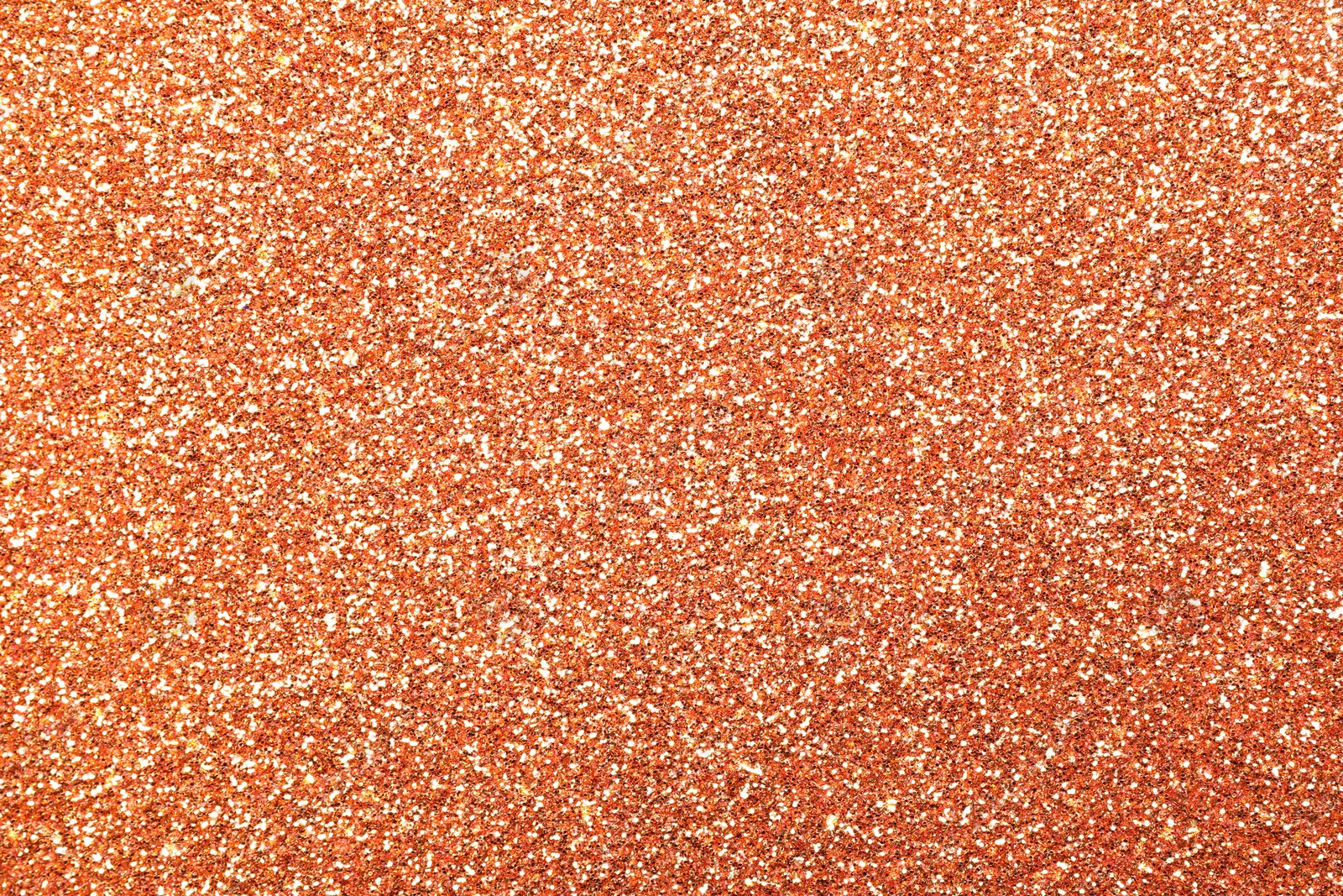 Image of Beautiful shiny peach glitter as background, closeup