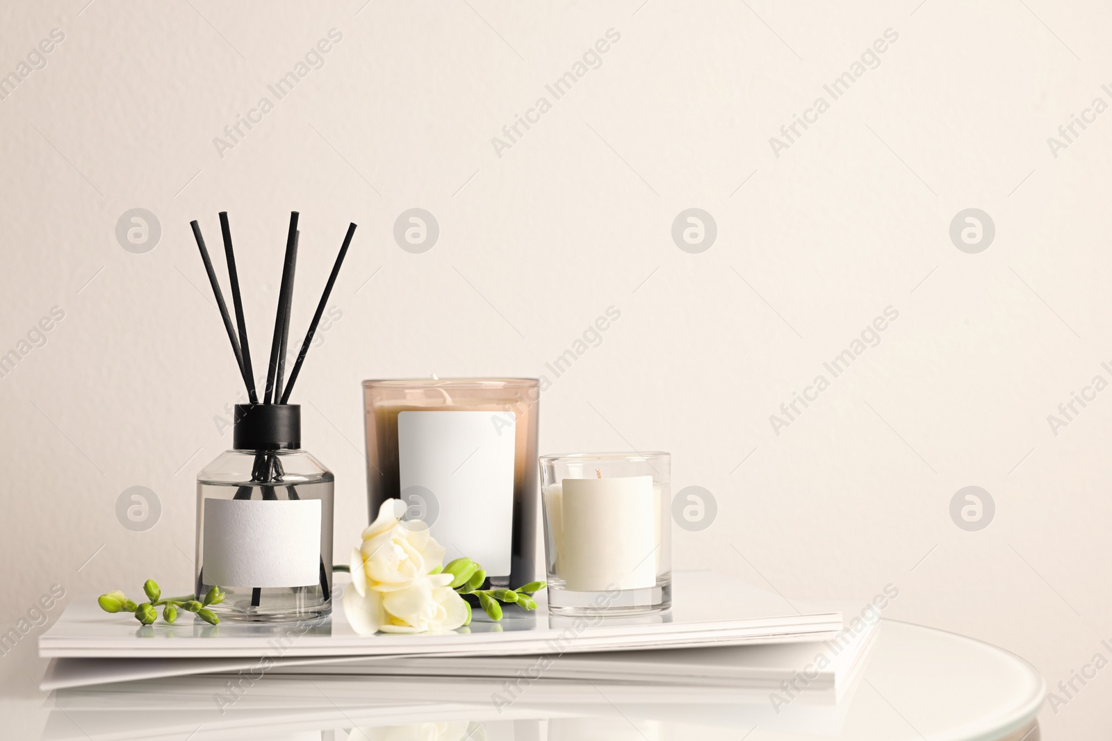 Photo of Composition with aromatic reed air freshener on white table, space for text