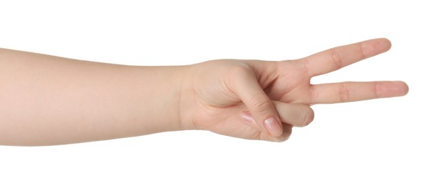 Playing rock, paper and scissors. Woman making scissors with her fingers on white background, closeup