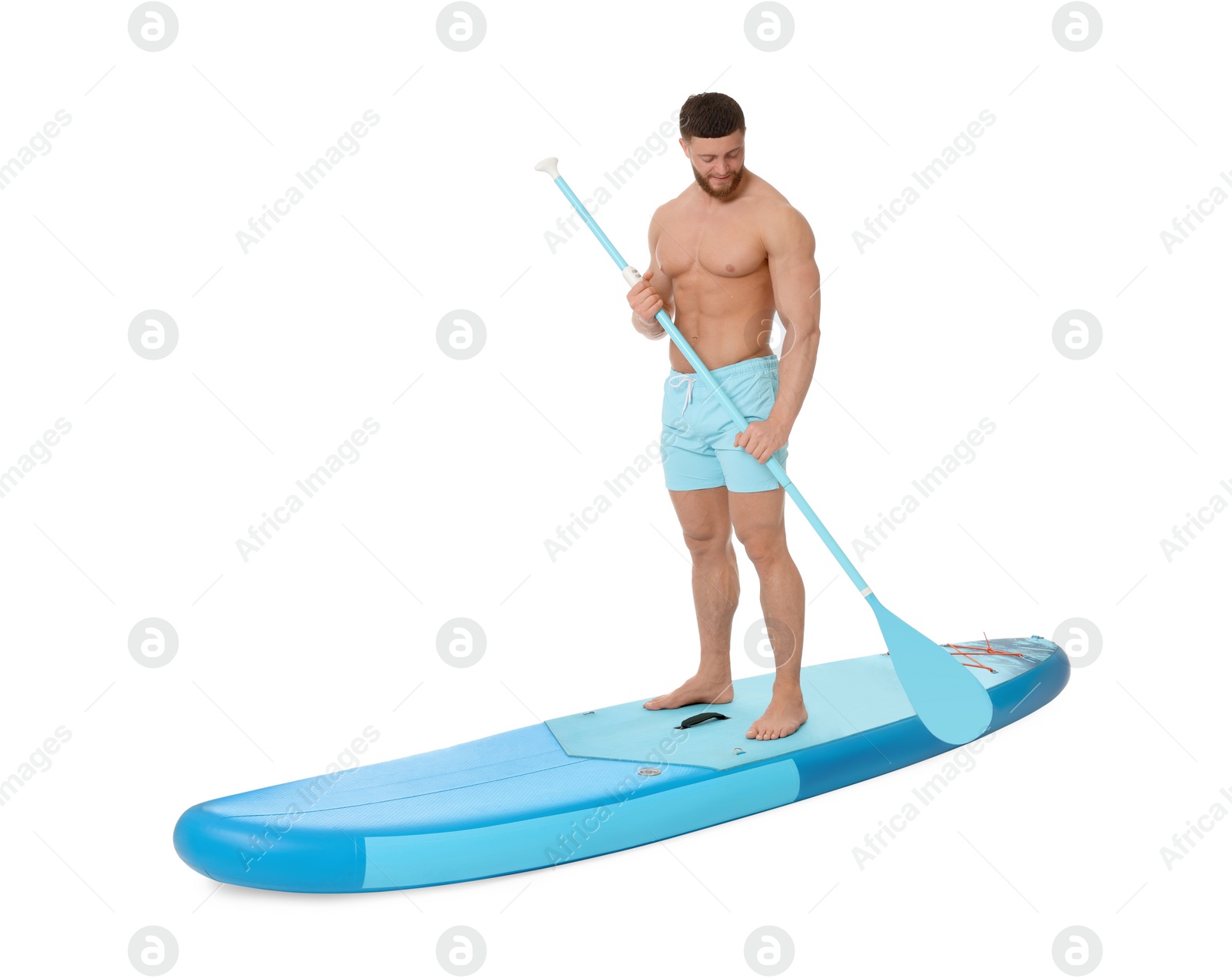 Photo of Handsome man with paddle on blue SUP board against white background