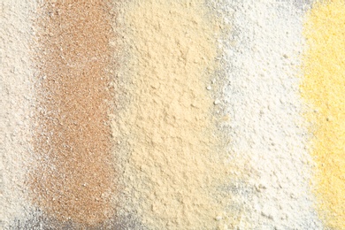 Stripes of different flour types as background, top view