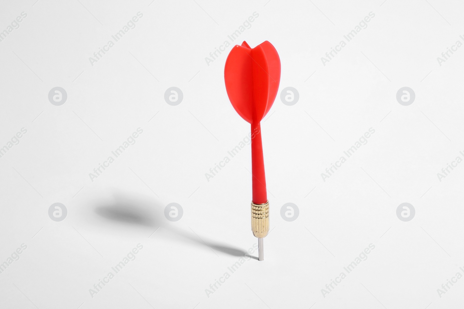 Photo of Red dart arrow for game on white background