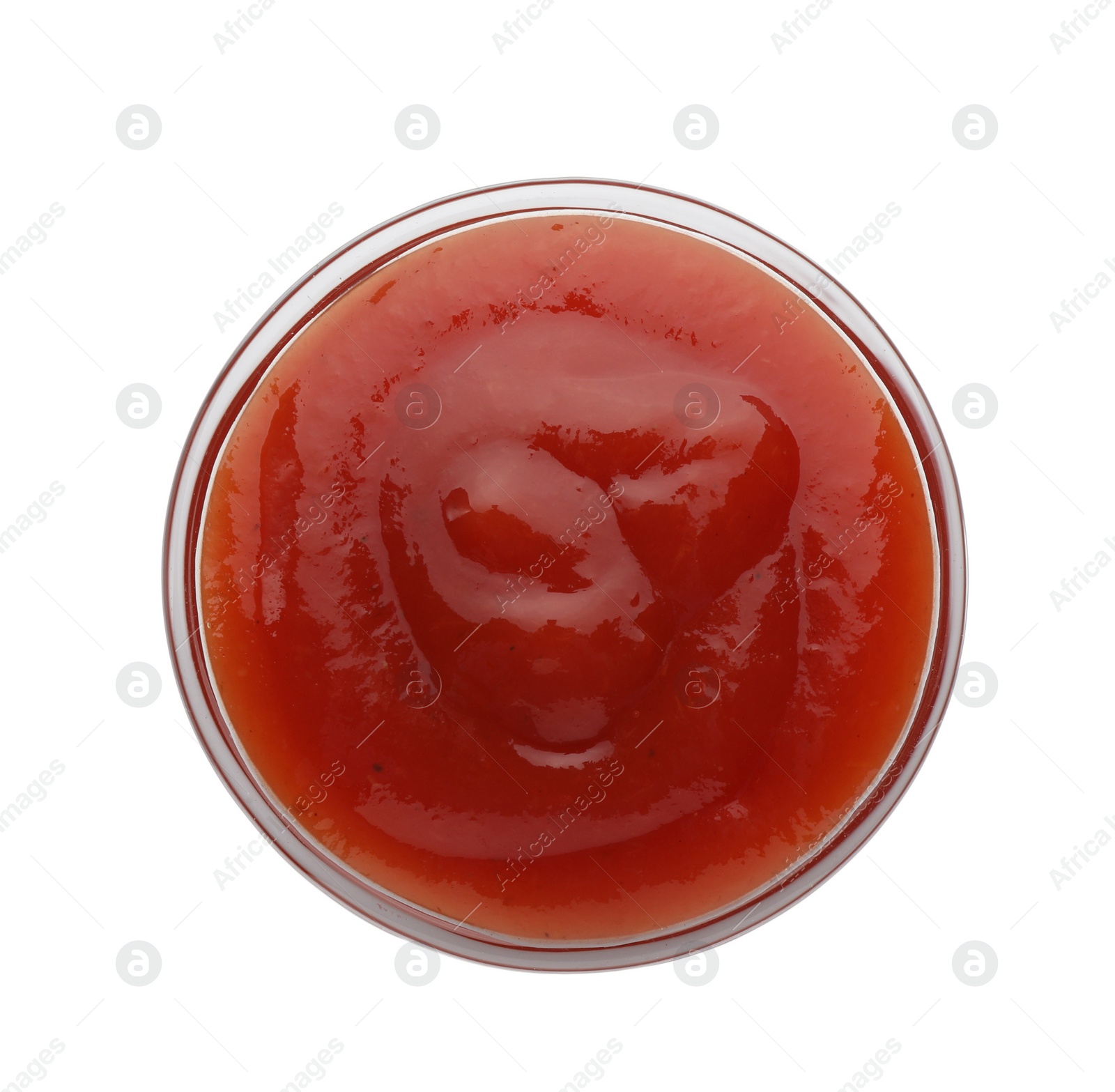 Photo of Tasty ketchup in bowl isolated on white, top view