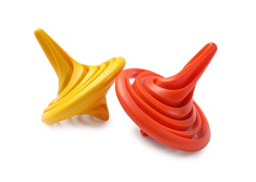 Photo of Two colorful spinning tops on white background