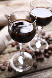 Glasses of coffee liqueur on table, closeup