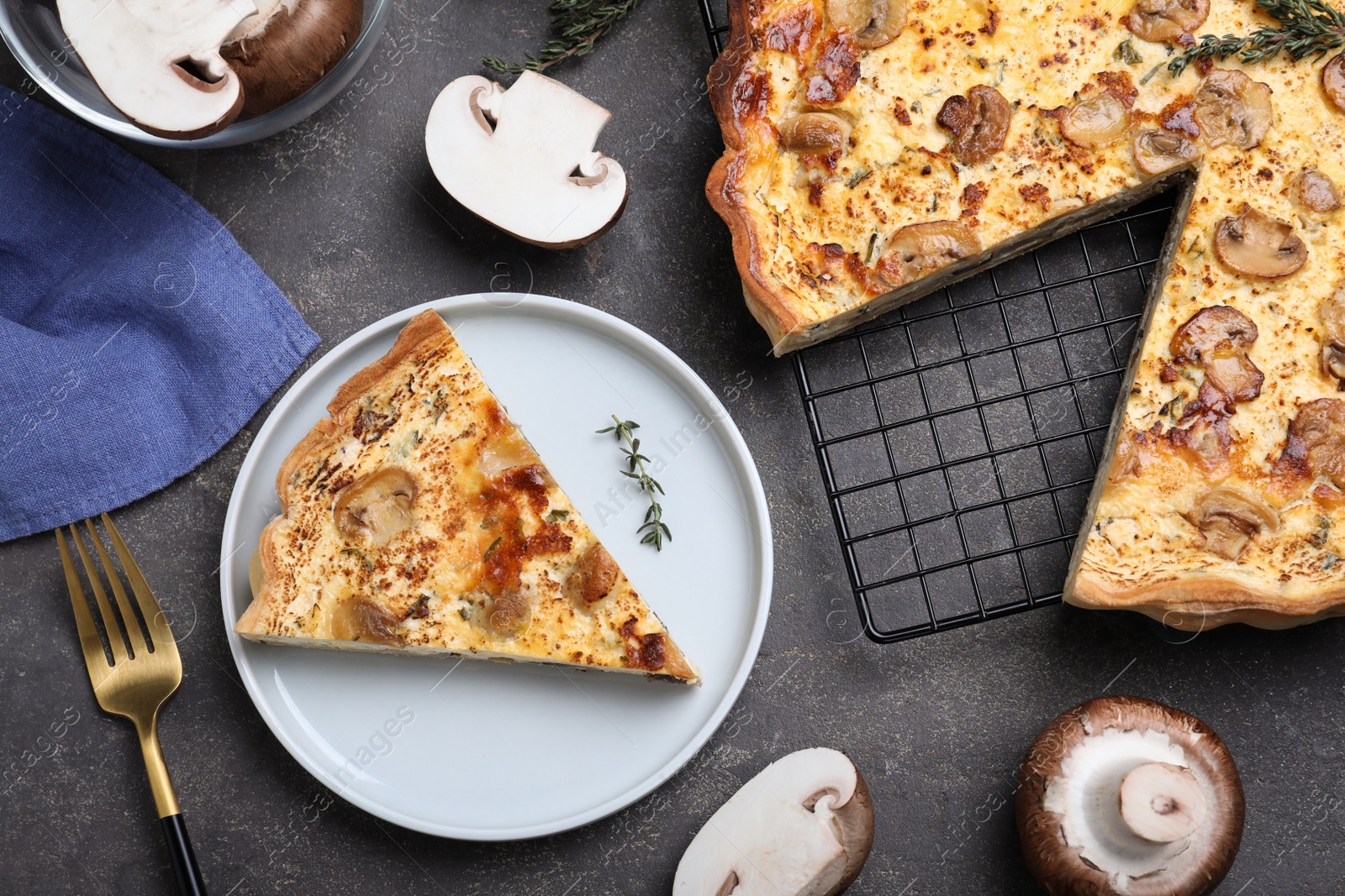 Photo of Delicious pie with mushrooms and cheese served on grey table, flat lay
