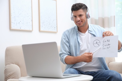 Photo of Teacher giving online lesson during quarantine. Studying at home