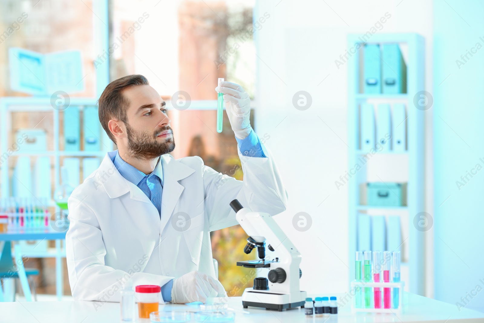 Photo of Young scientist working in laboratory, space for text. Chemical analysis