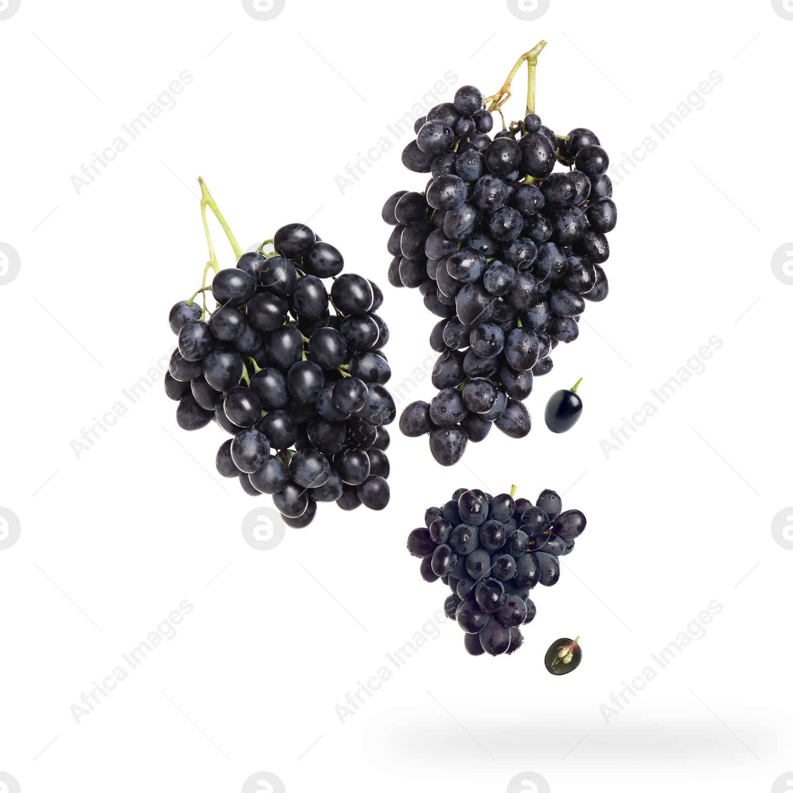 Image of Fresh grapes in air on white background