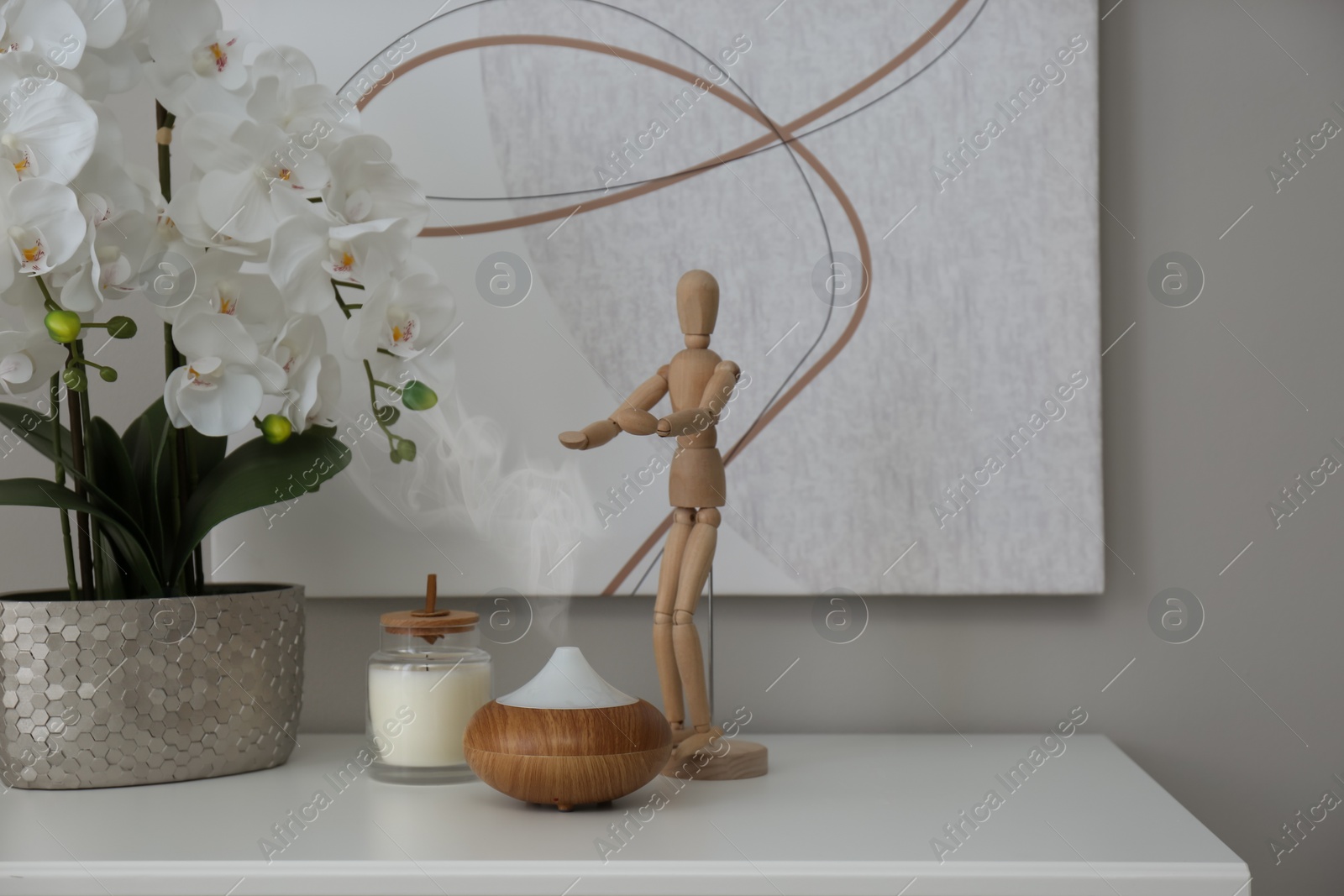 Photo of Aroma oil diffuser on white commode in room