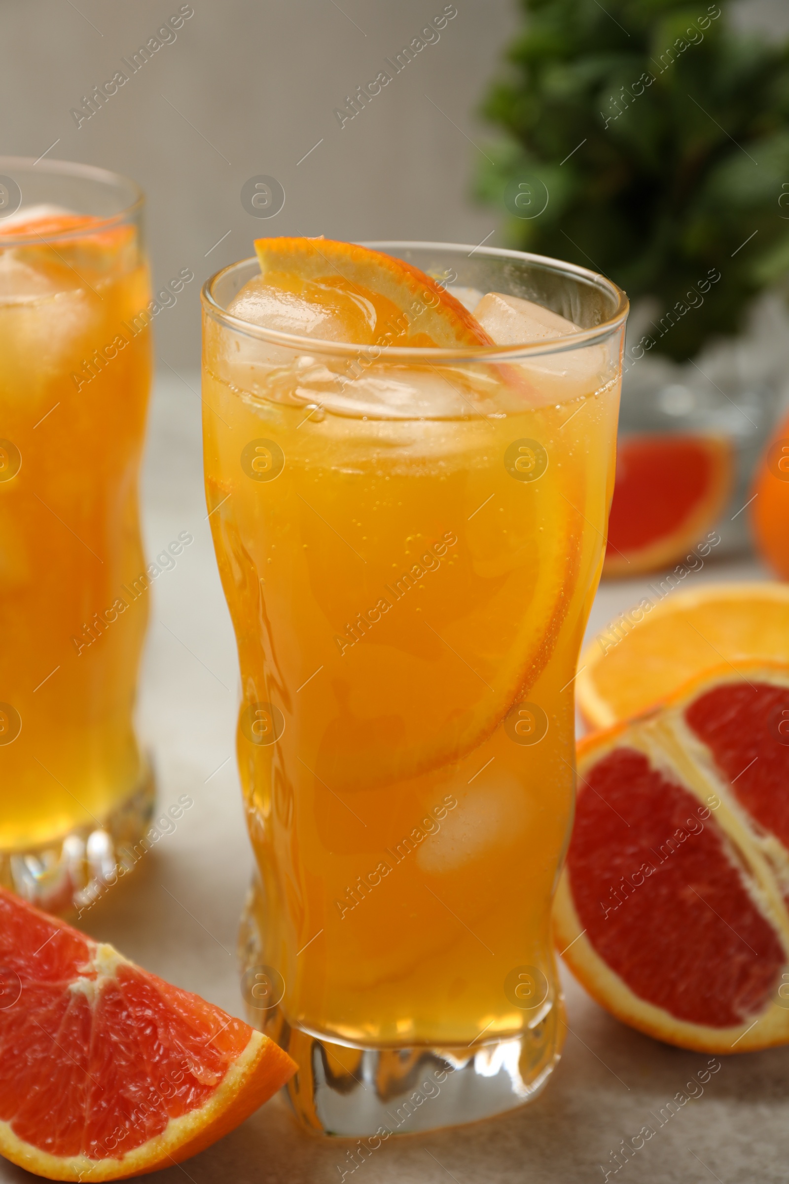 Photo of Delicious orange soda water on light table