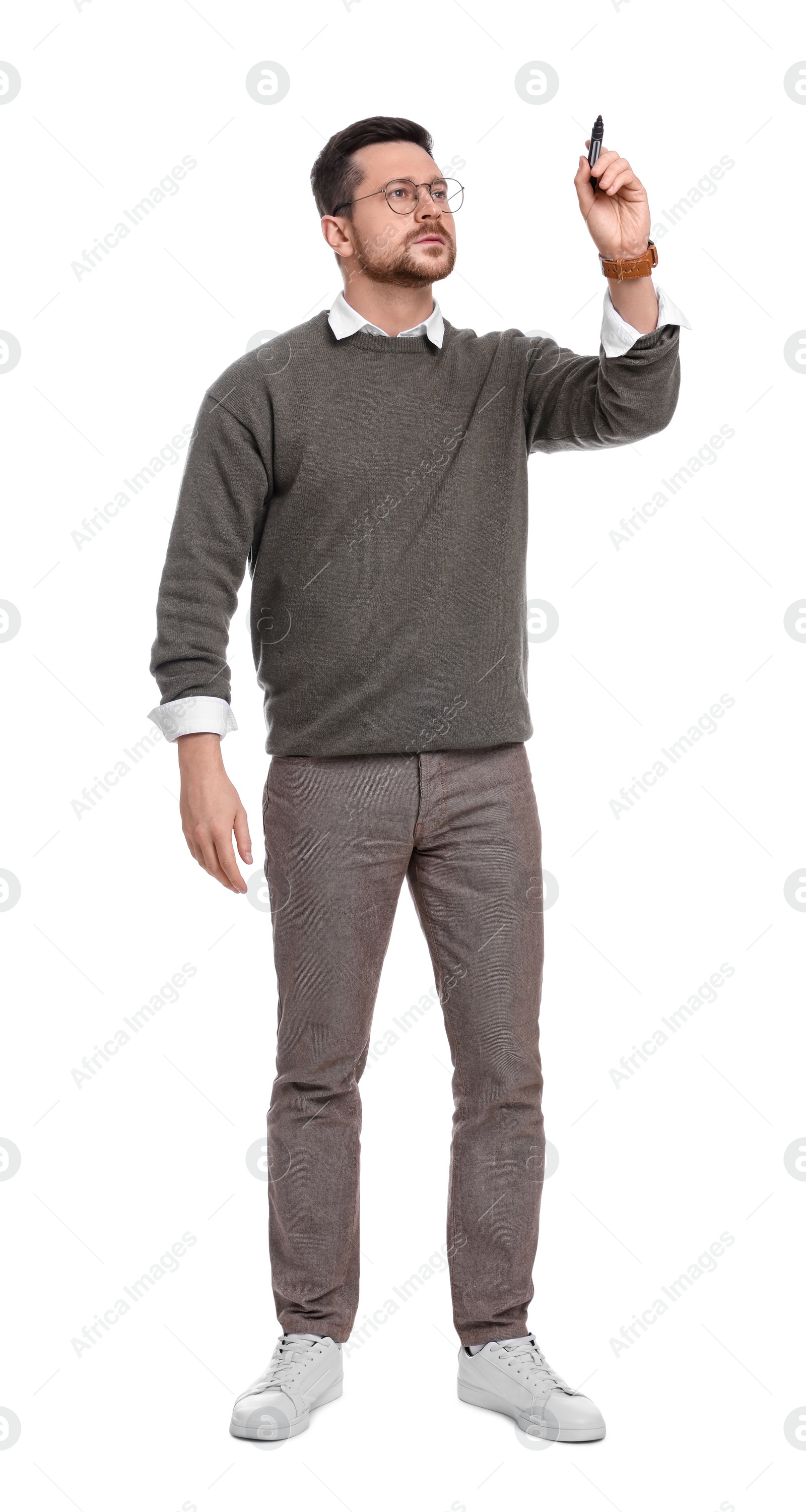 Photo of Handsome bearded businessman with marker on white background