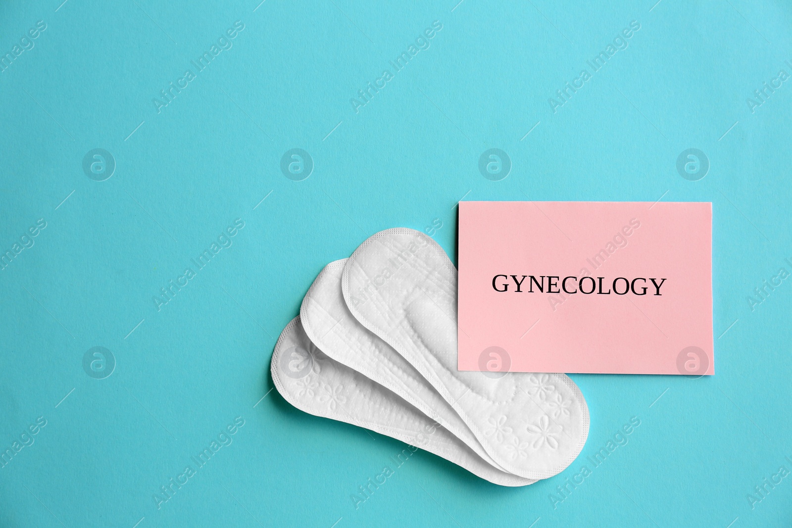 Photo of Flat lay composition with menstrual pads on color background. Gynecological care