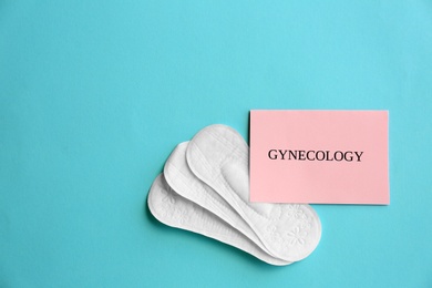 Flat lay composition with menstrual pads on color background. Gynecological care