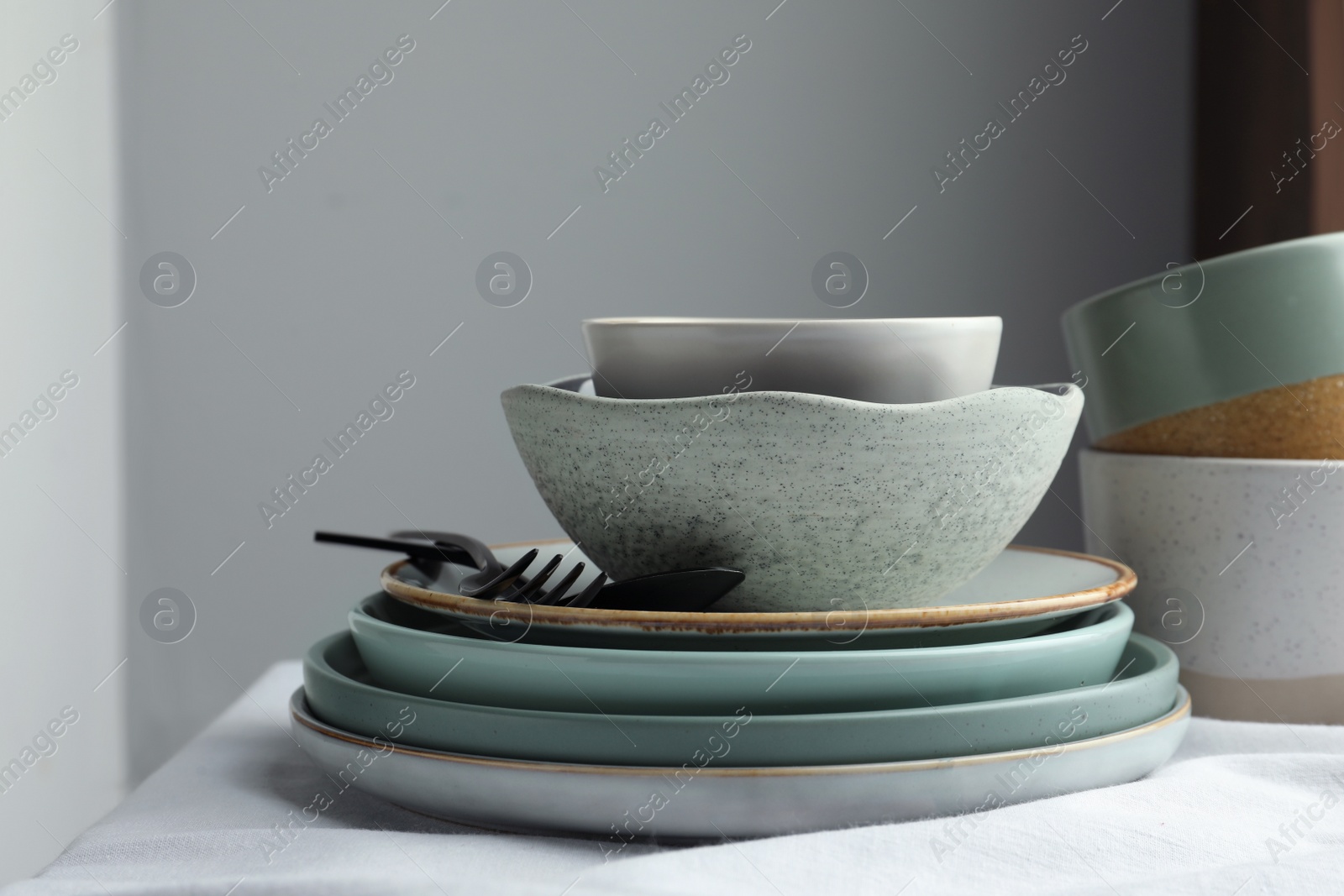 Photo of Stylish empty dishware and cutlery on table indoors