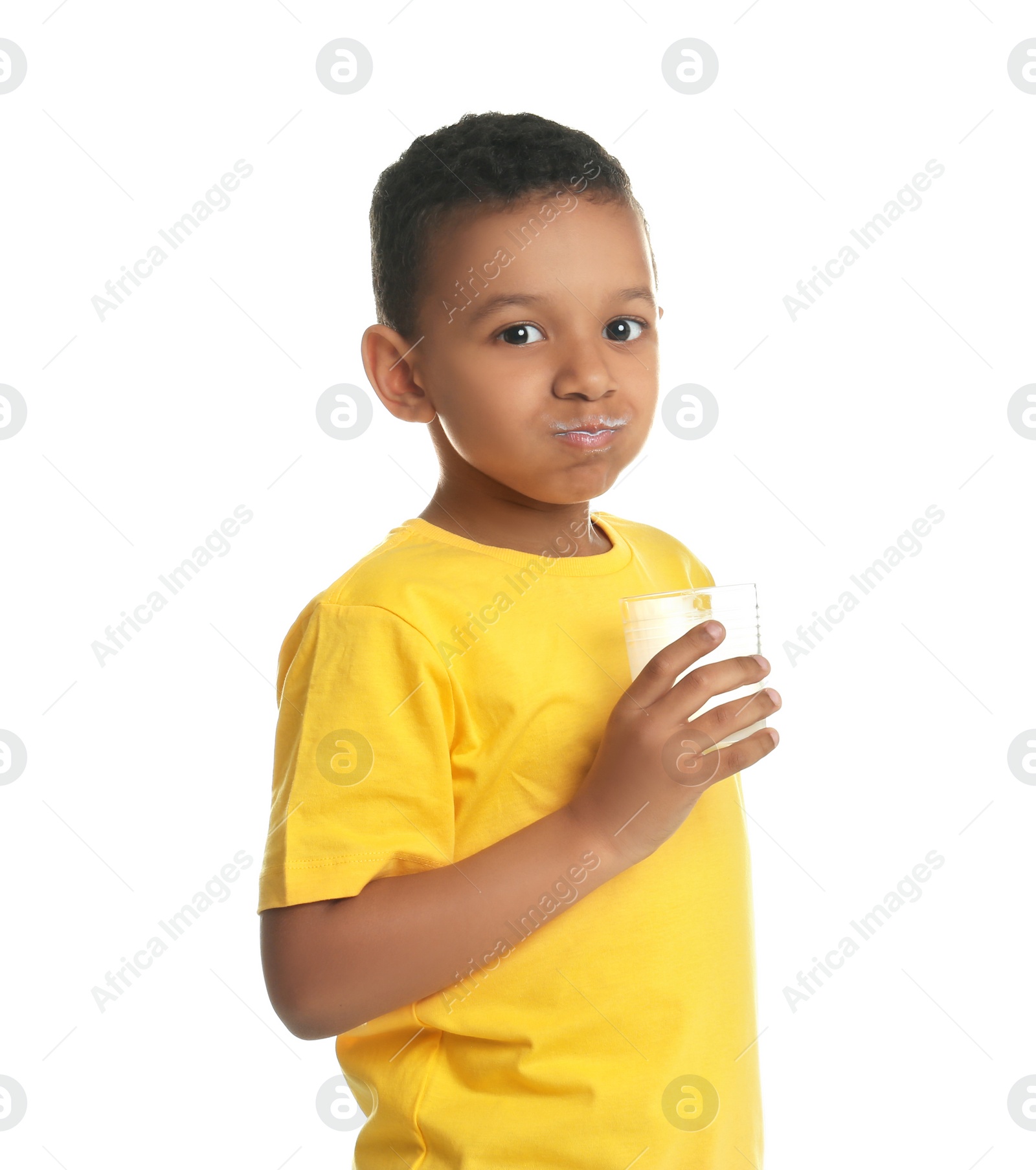 Photo of Adorable African-American boy with glass of milk on white background