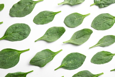 Photo of Fresh green healthy spinach leaves on white background, top view