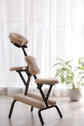 Photo of Modern massage chair in clinic. Medical equipment