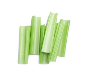 Photo of Fresh cut celery stalks isolated on white, top view