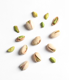 Photo of Composition with organic pistachio nuts on white background, top view