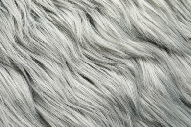 Photo of Texture of grey faux fur as background, closeup