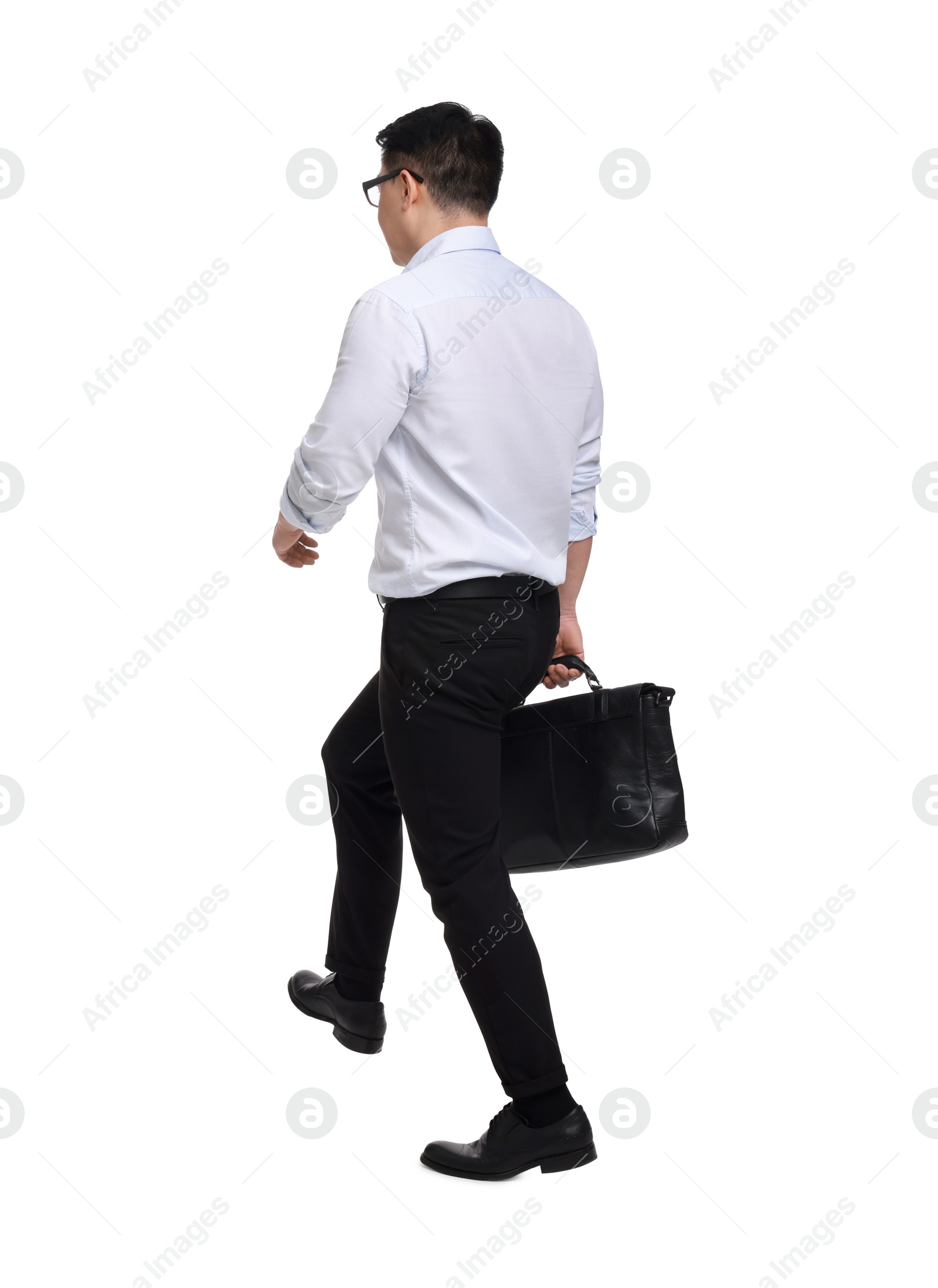 Photo of Businessman with briefcase walking on white background