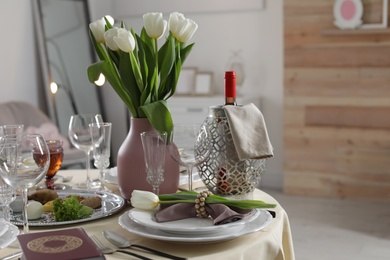 Festive Passover table setting with Torah at home. Pesach celebration