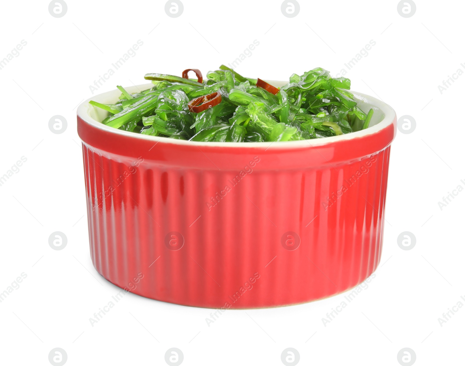 Photo of Japanese seaweed salad in bowl isolated on white