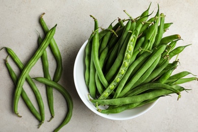 Fresh green beans on light grey table, flat lay