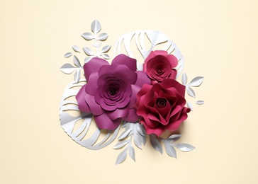 Photo of Different beautiful flowers and branches made of paper on beige background, flat lay