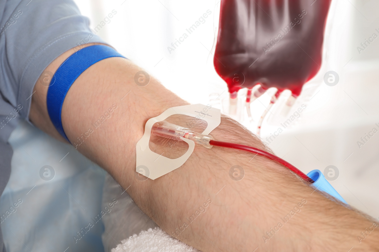 Photo of Man donating blood to save someone's life in hospital