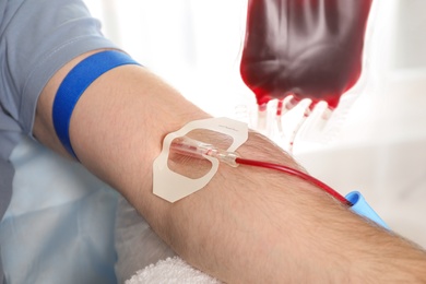 Man donating blood to save someone's life in hospital