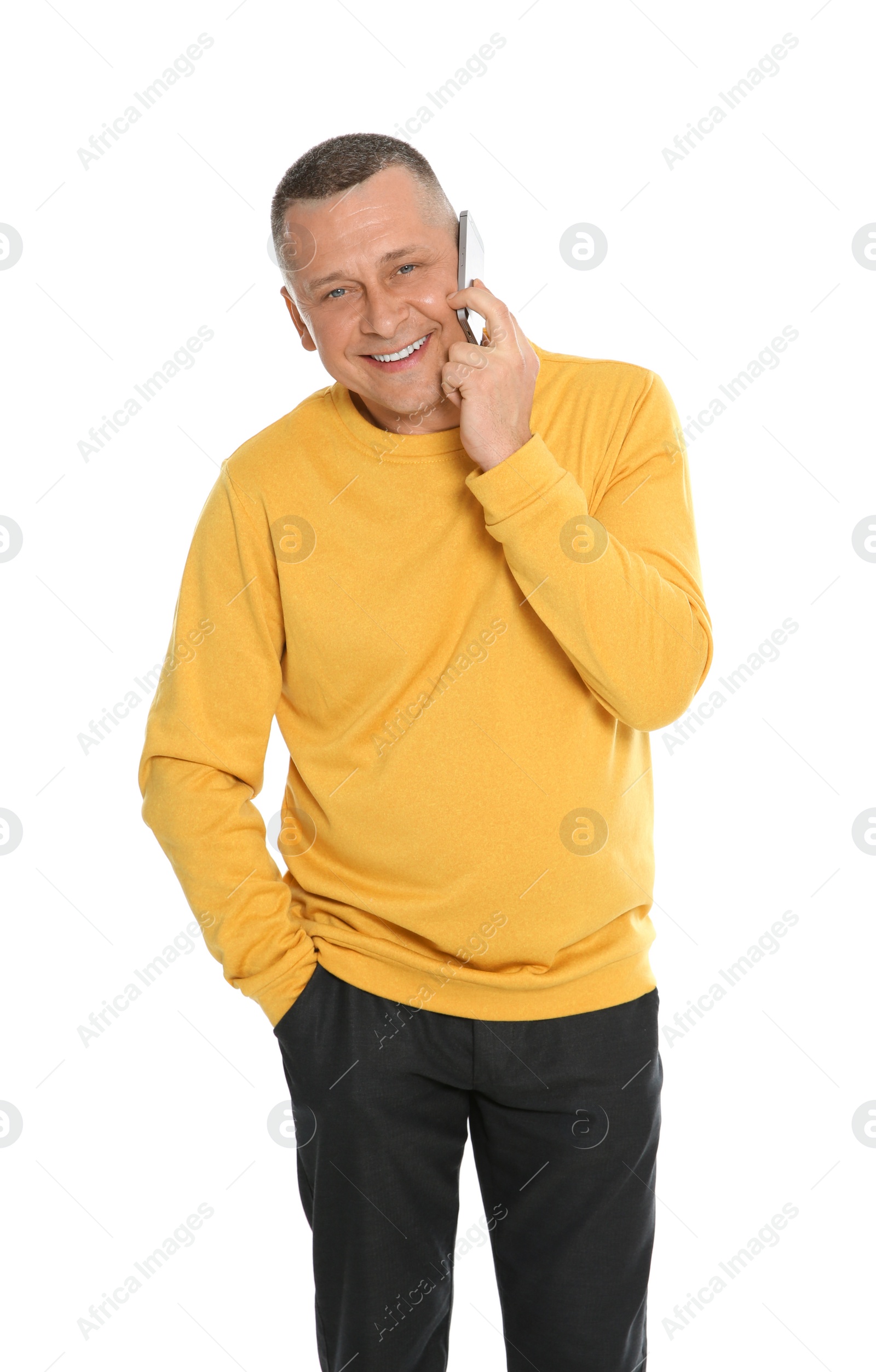 Photo of Portrait of mature man talking on phone against white background
