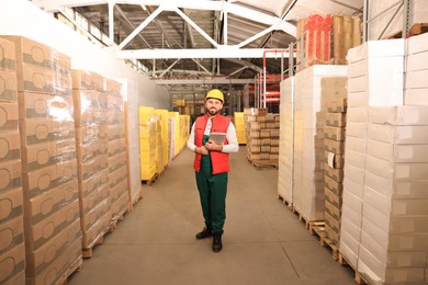 Image of Man with tablet working at warehouse. Logistics center