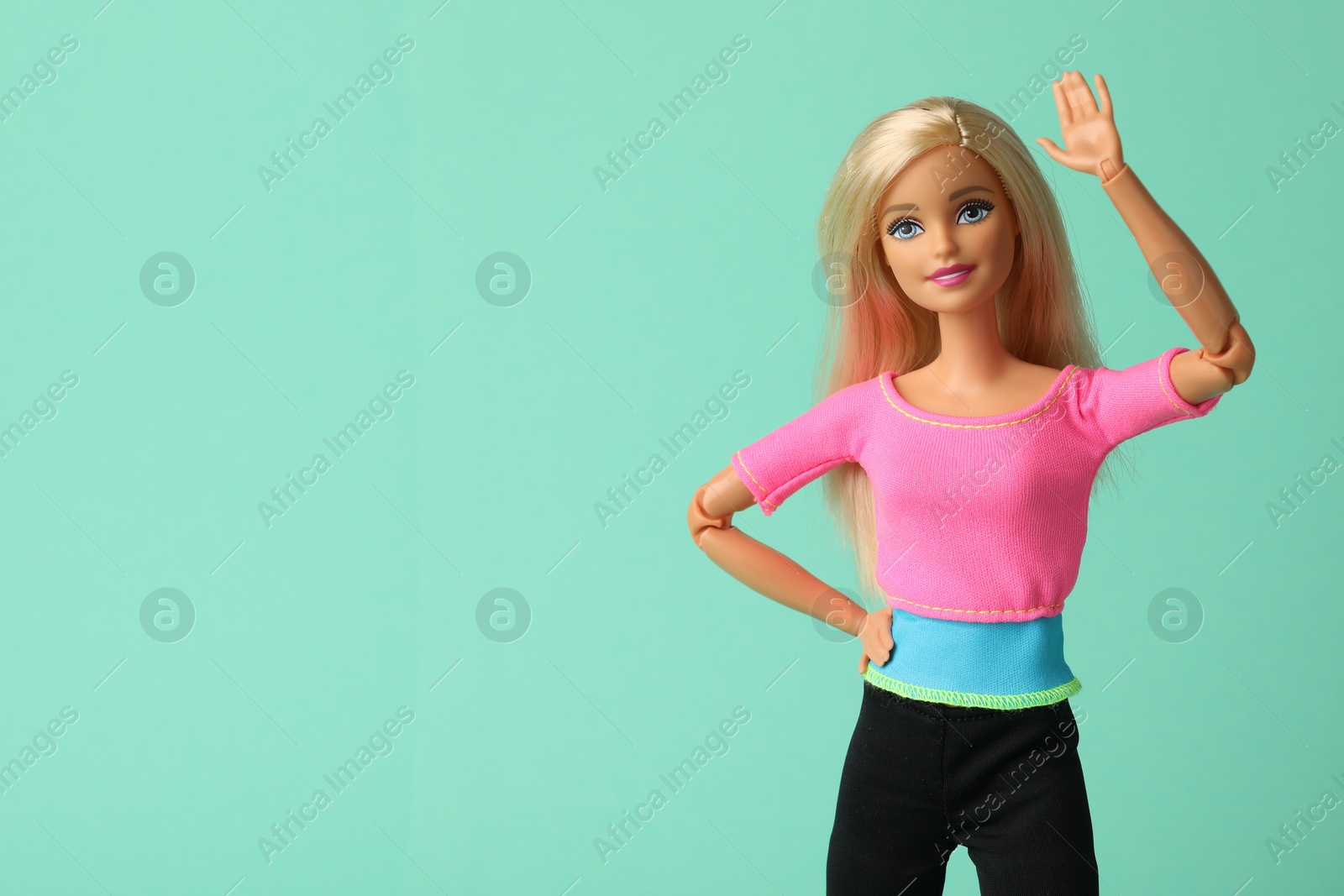 Photo of Mykolaiv, Ukraine - September 2, 2023: Beautiful Barbie doll on turquoise background, space for text