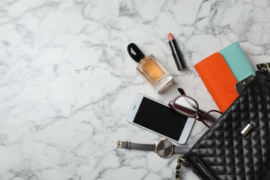 Photo of Flat lay composition with stylish bag, wallet and accessories on marble background