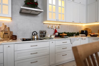 Photo of Kitchen countertop with festive decor. Christmas celebration