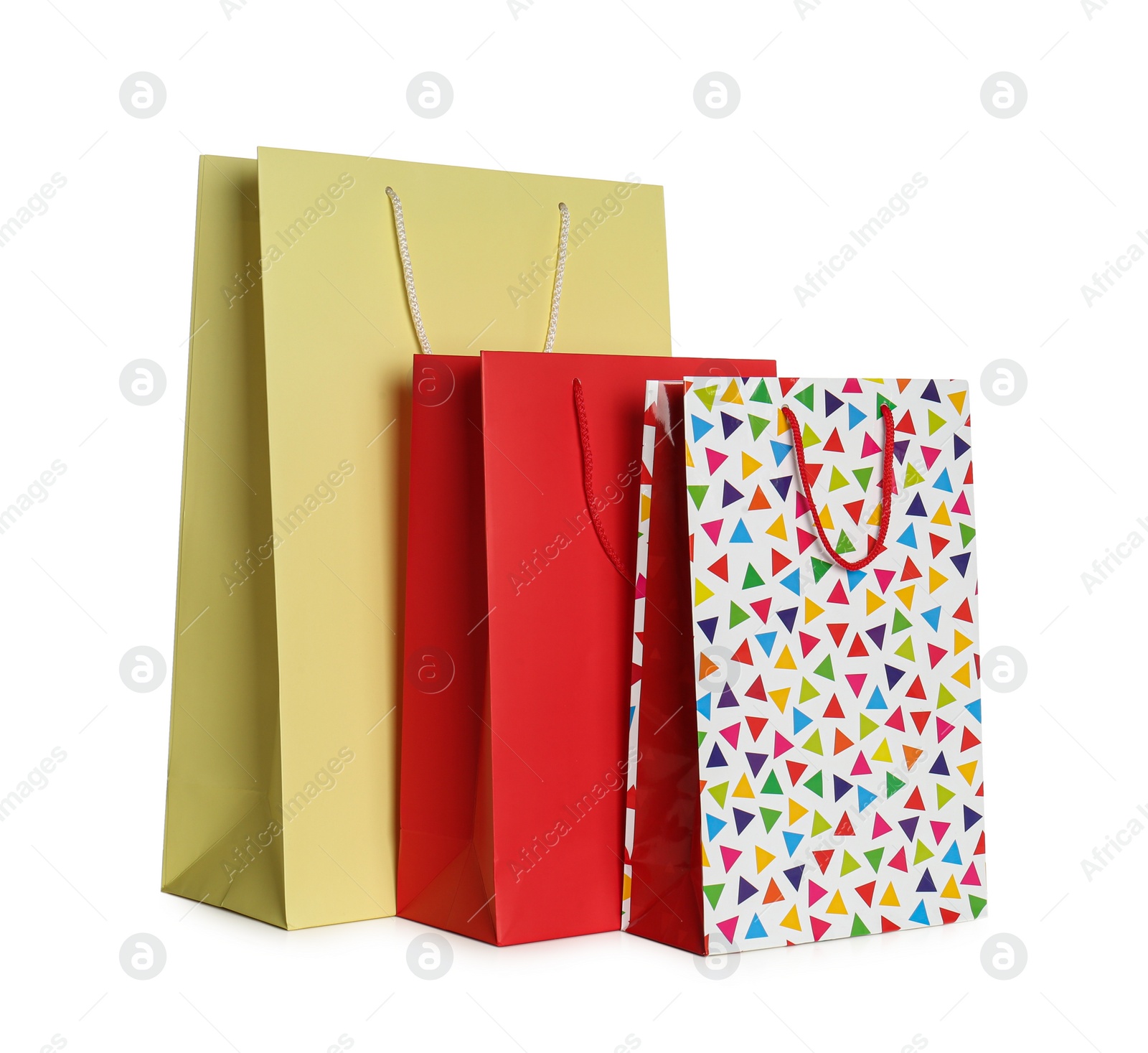 Photo of Stylish gift paper bags isolated on white