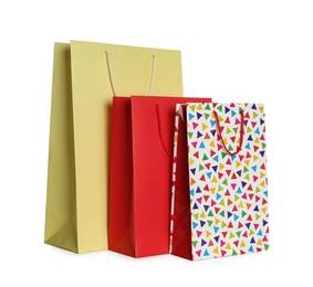 Photo of Stylish gift paper bags isolated on white