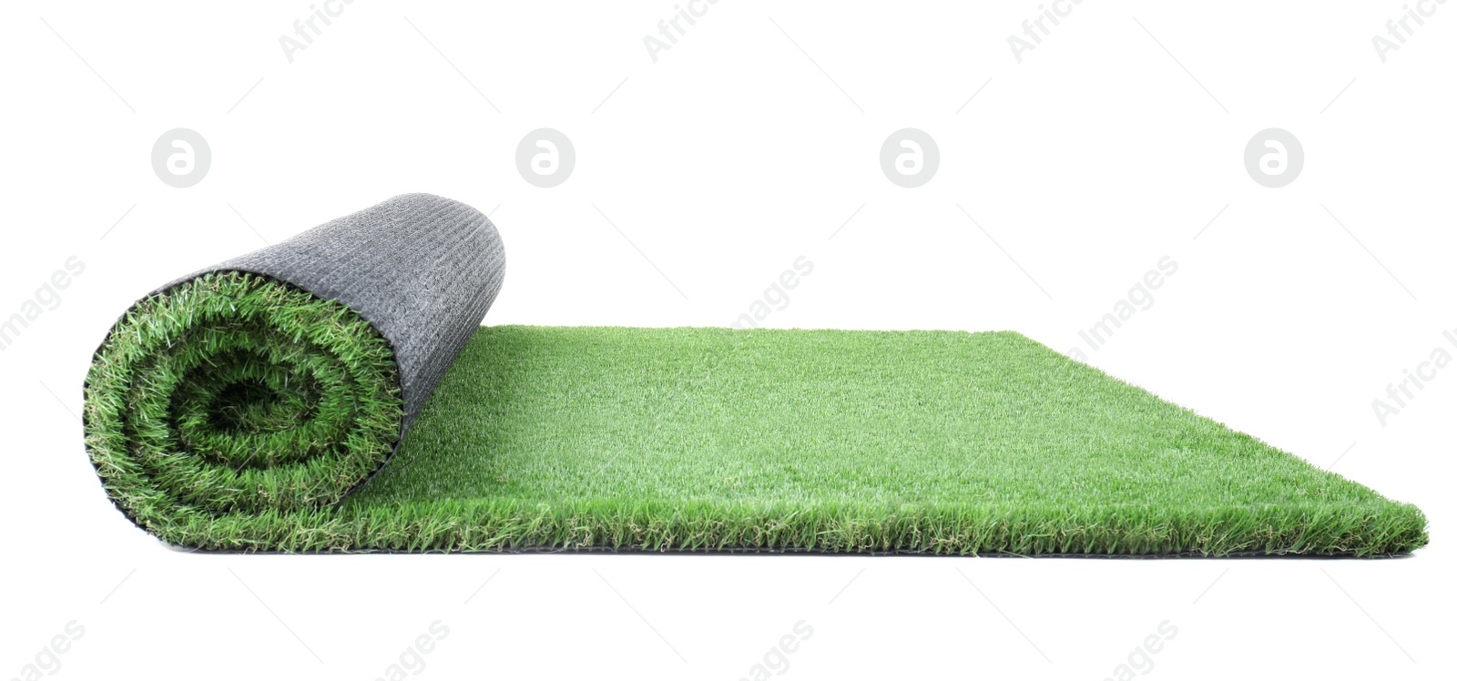 Photo of Rolled artificial grass carpet on white background. Exterior element