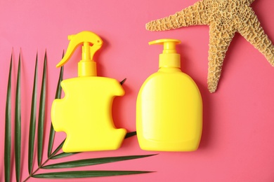 Photo of Flat lay composition with sun protection products on color background