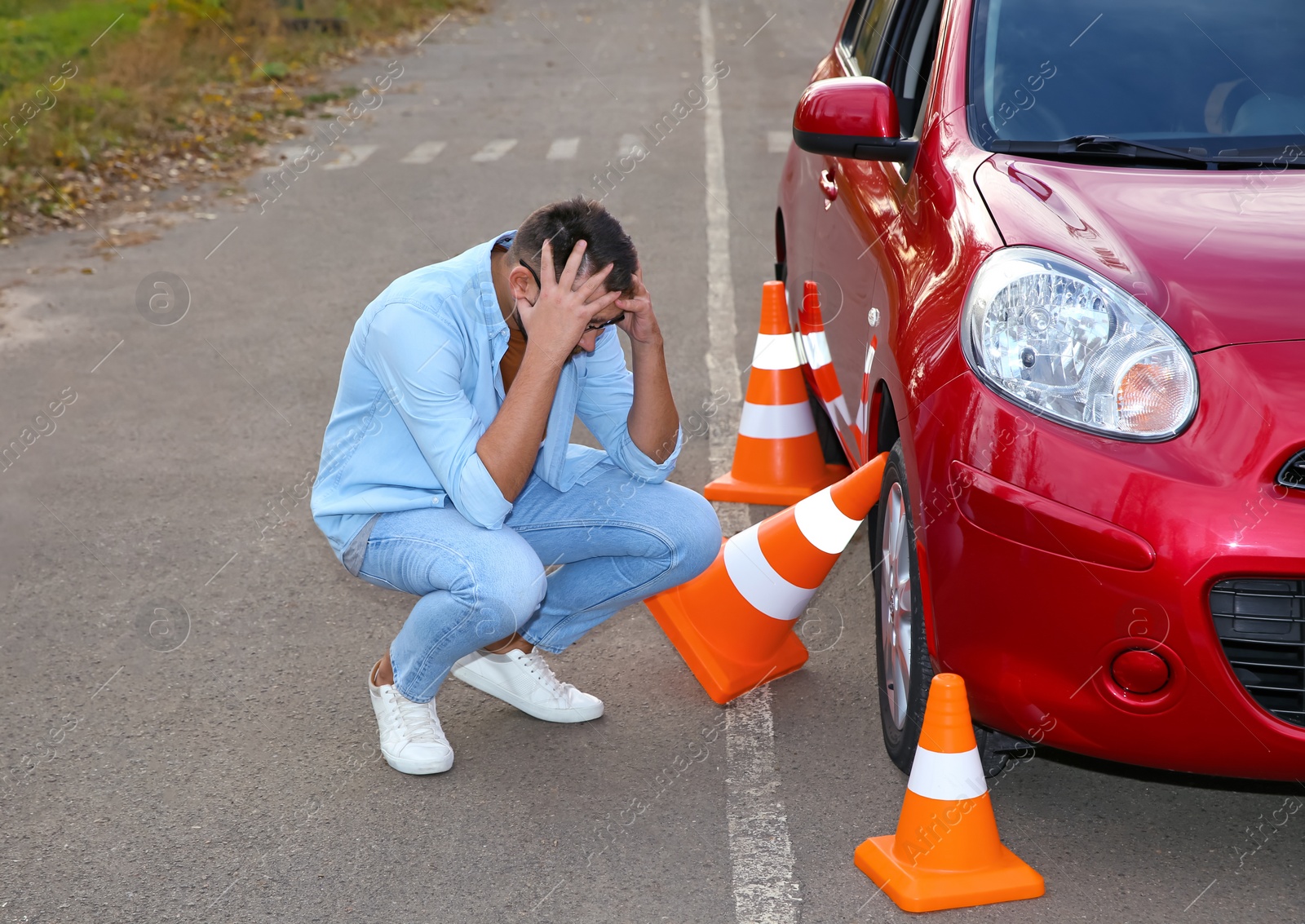 Photo of Stressed man near car outdoors. Passing driving license exam