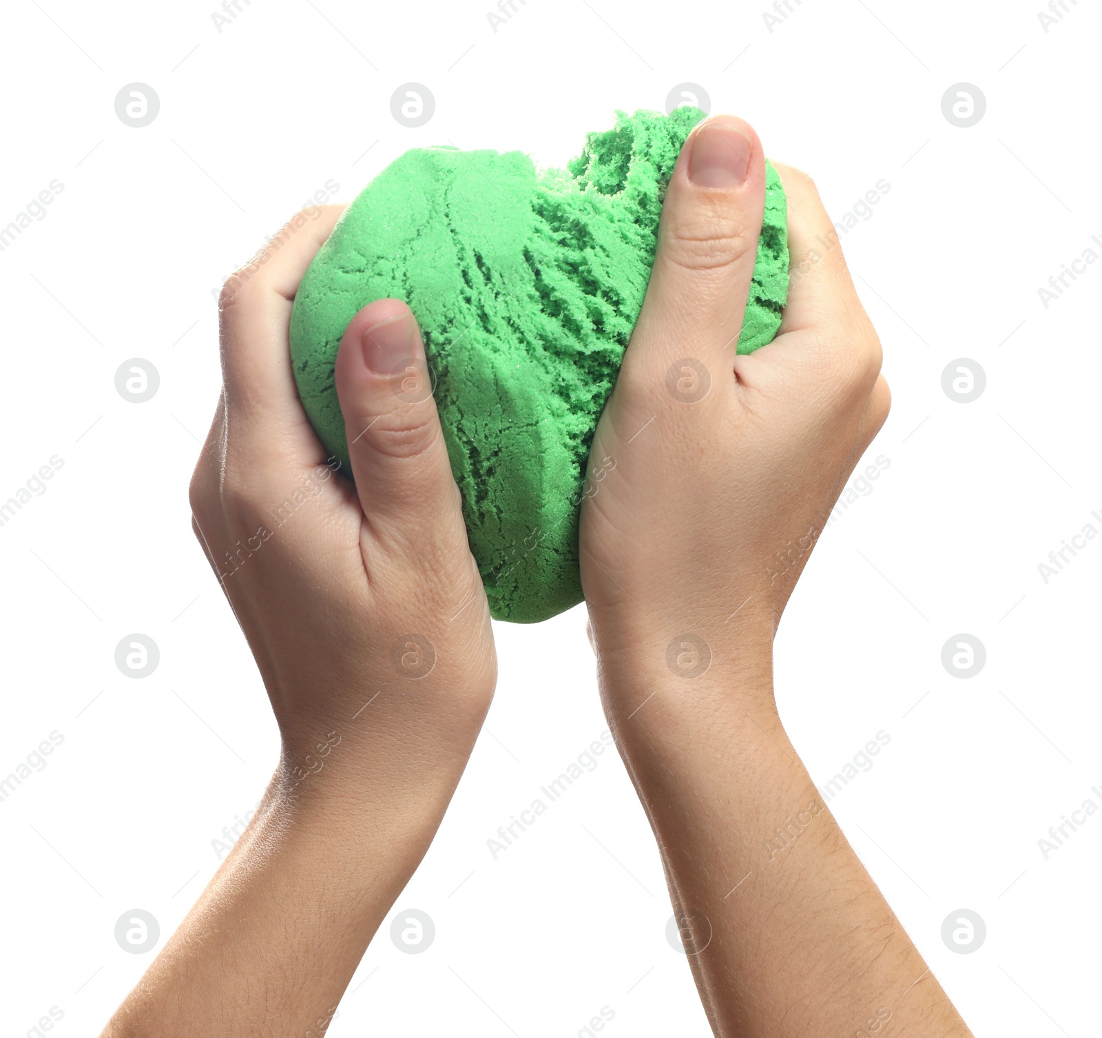 Photo of Woman playing with green kinetic sand on white background, closeup